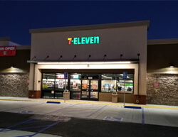 Outdoor image image of 7-11 showing main entrance and parking lot.